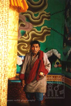 54. Man w golden prayer wheel wm.jpg